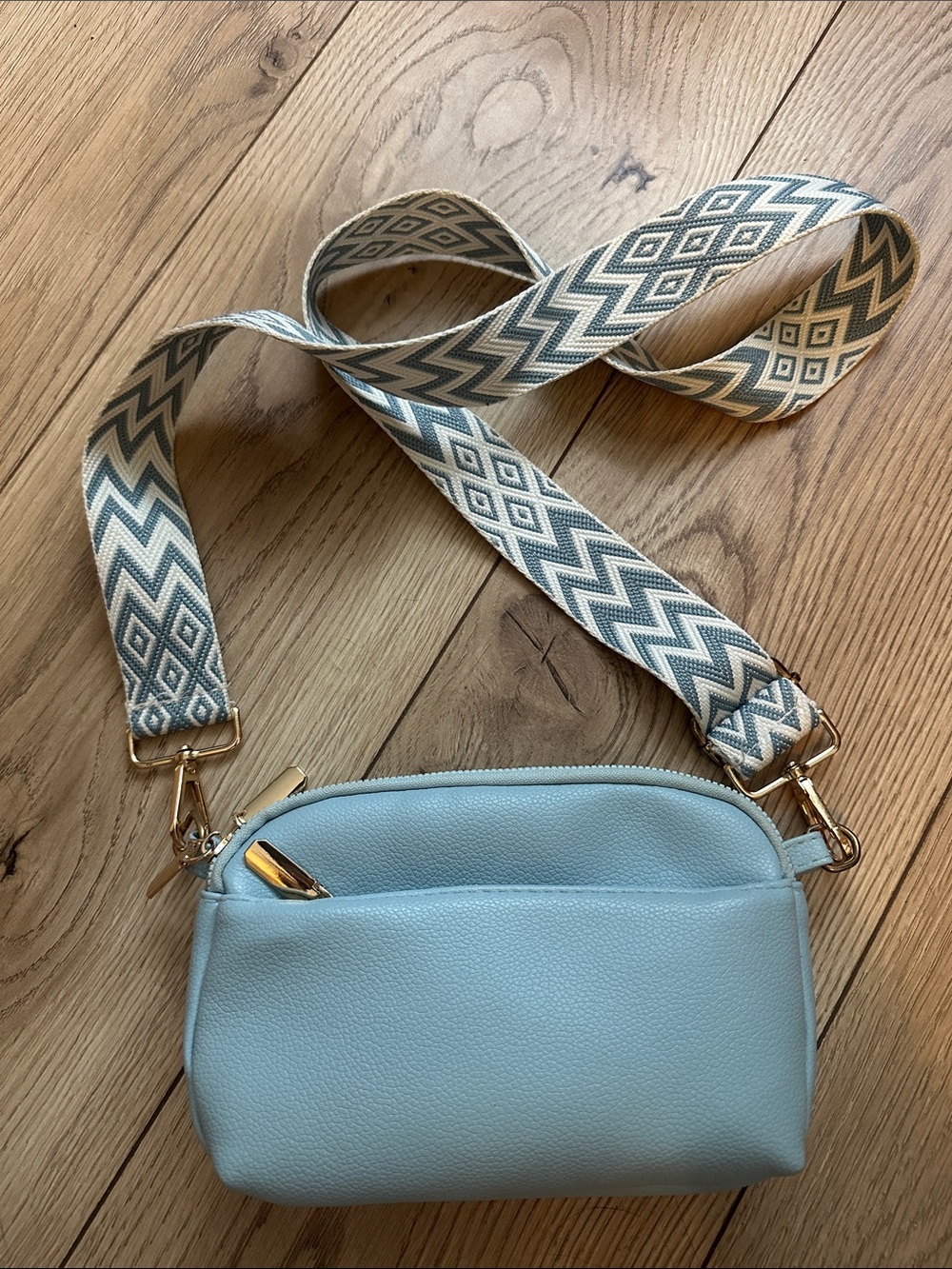Pebbled Light Blue Crossbody Bag with Patterned Strap